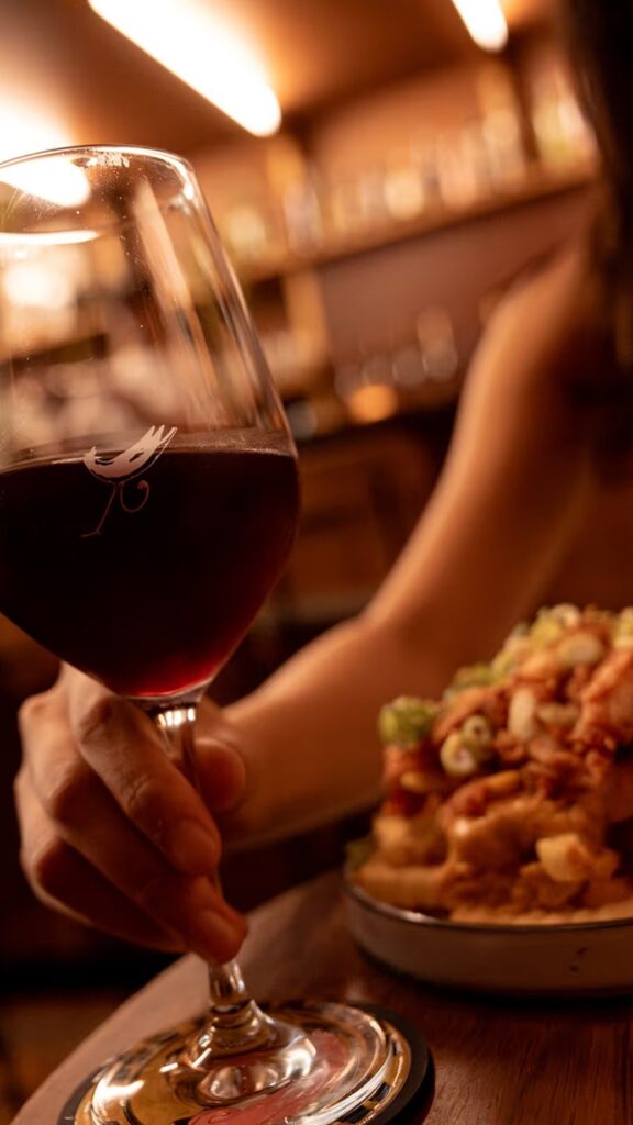 A glass of Victorian red and crispy chicken
