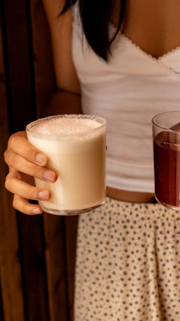A matcha milk punch in hand