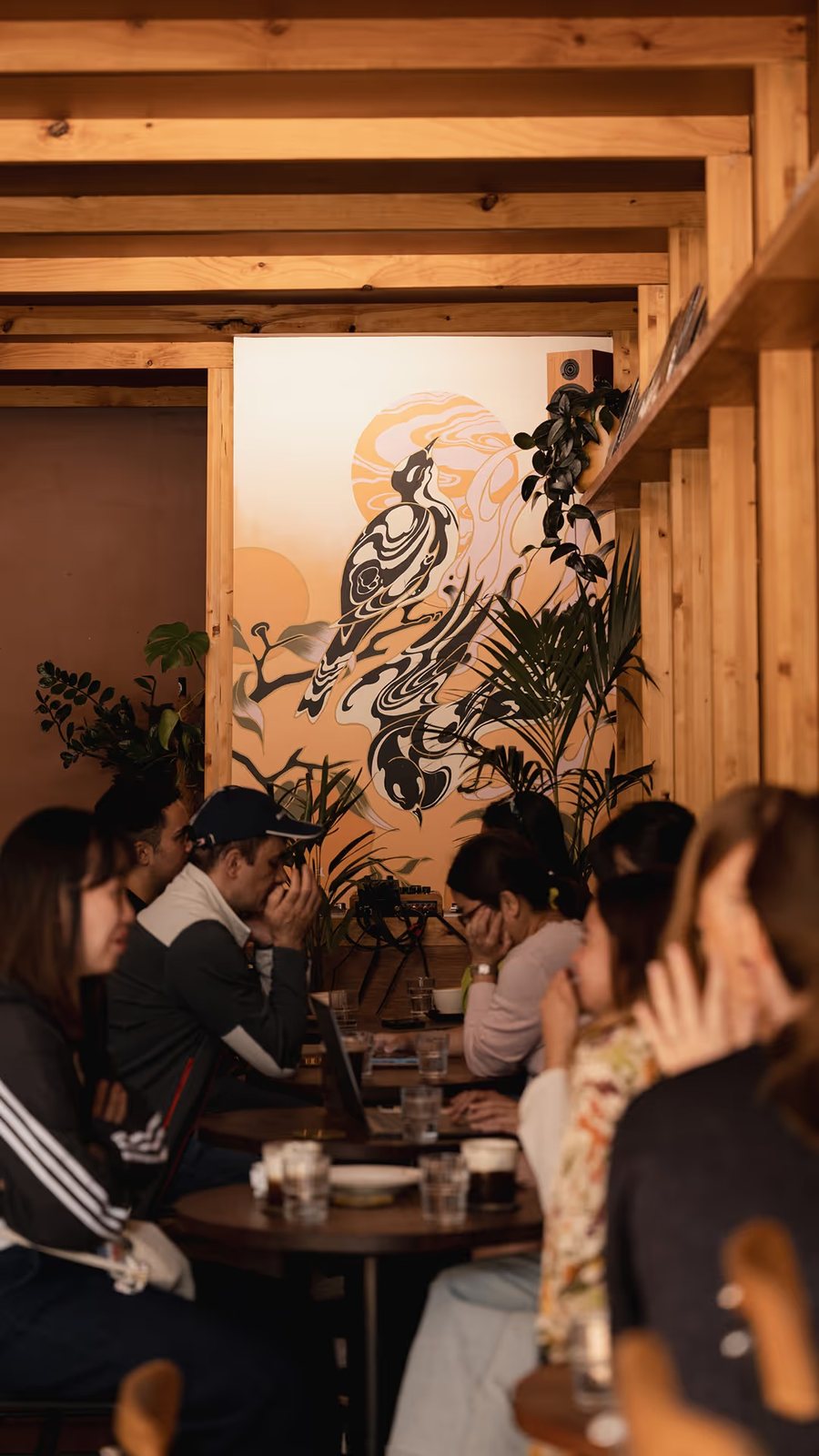 Inside Good Measure — timber beams, the magpie mural and a full room